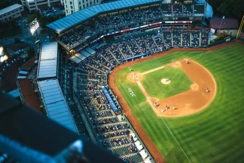 Aerial view of a baseball stadium with players on the field and fans